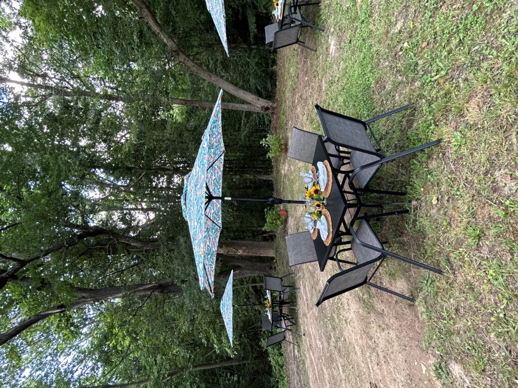 Three tables and umbrellas